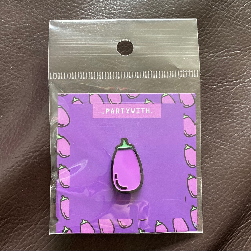 SEALED! 1” Eggplant pin.